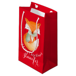 Le renard mignon a enveloppé le sac de cadeau de