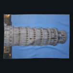 Leaning Tower at Dusk Geschirrtuch<br><div class="desc">This captivating photograph showcases the iconic Leaning Tower of Pisa standing elegantly against a deep blue twilight sky in Pisa. The historic marble tower, famous for its unmistakable tilt, is beautifully illuminated, highlighting its intricate Romanesque arches and layered columns. The soft evening light creates a striking contrast between the glowing...</div>