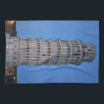 Leaning Tower at Dusk Geschirrtuch<br><div class="desc">This captivating photograph showcases the iconic Leaning Tower of Pisa standing elegantly against a deep blue twilight sky in Pisa. The historic marble tower, famous for its unmistakable tilt, is beautifully illuminated, highlighting its intricate Romanesque arches and layered columns. The soft evening light creates a striking contrast between the glowing...</div>