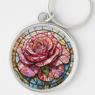 Lebendige blühende Rose, umgeben von aufwändigen D Schlüsselanhänger