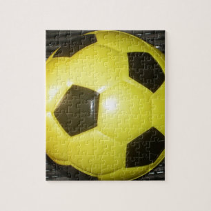 Lebendige gelbe und schwarze Fußball-Kunst