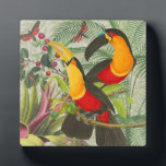 Lebhafte tropische Vögel Kunst Exotischer Dschunge Fotoplatte<br><div class="desc">Mit diesem beeindruckenden Design mit zwei farbenfrohen Toucan-Vögeln bringen Sie die lebendige Energie des Regenwaldes in Ihr Leben! Inspiriert durch klassische Vintage botanische Illustrationen, zeigt dieses Muster die Vögel, die zwischen üppig grünen Palmenfronten, exotischen roten Blume und verspielten Schmetterlingen stehen. Gelb, rot und smaragdgrün machen dieses Stück zu einem idealen...</div>