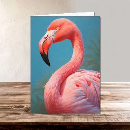 Lebhafter rosa Flamingo auf einem blauen Hintergru Karte
