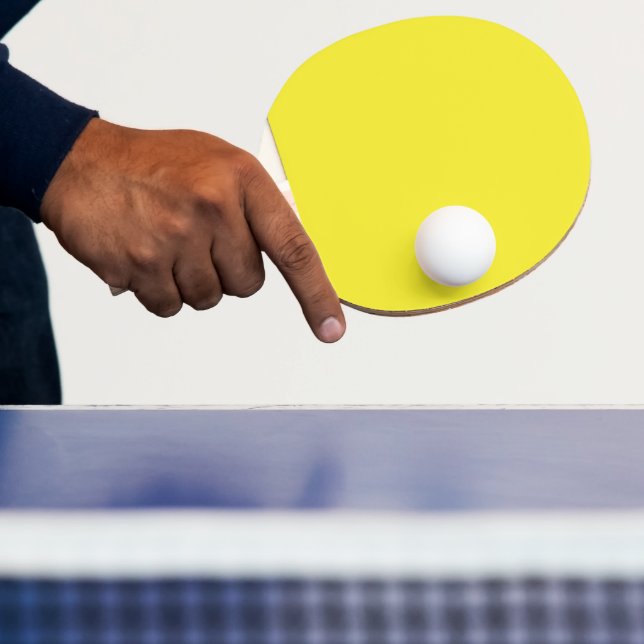 Lebhafter, solider gelber Hintergrund Tischtennis Schläger (InSitu)