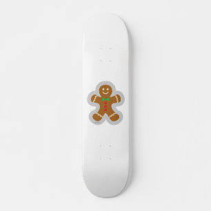 Lebkuchenmann macht den Engel im Schnee Skateboard