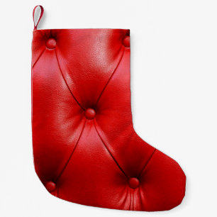 Ledertextur mit rotem Sofa Kleiner Weihnachtsstrumpf