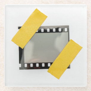 Leere 35mm Filmrahmen, gelbe Streifen. Glasuntersetzer