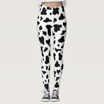 Guêtres noires et blanches d'impression de vache