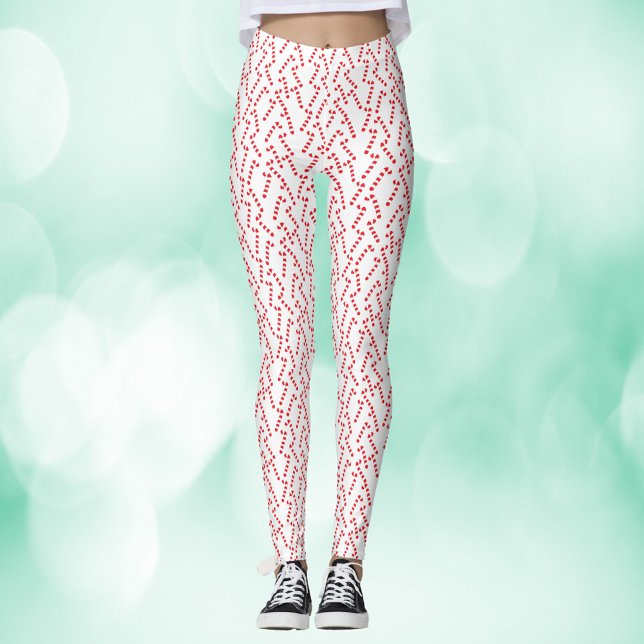 Leggings Motif blanc sucre de canne (A pair of leggings with a red and white candy cane pattern)