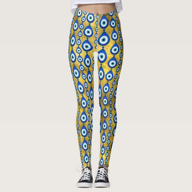 Leggings motif de l'oeil malin sur la texture dorée (Devant)