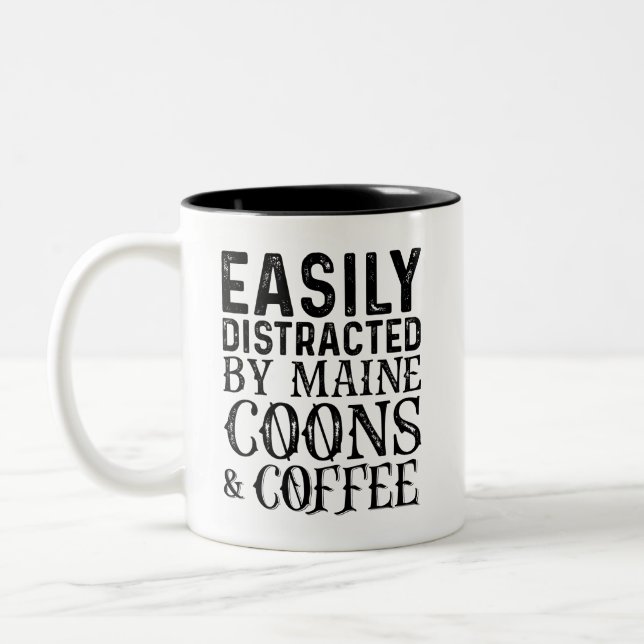 Leicht abgelenkt durch Maine-Coons und Kaffee Zweifarbige Tasse (Links)