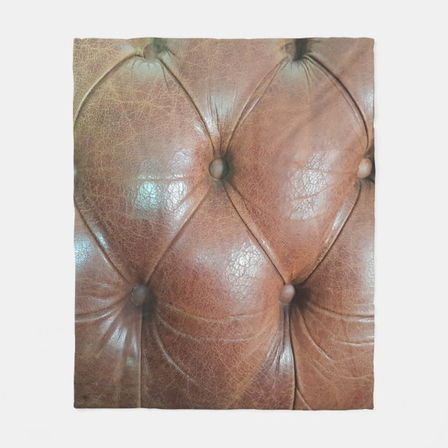 Leicht auf brauner Ledersofa-Oberfläche, textureab Fleecedecke (Vorderseite)