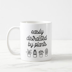 Leicht von Pflanze abgelenkt Kaffeetasse