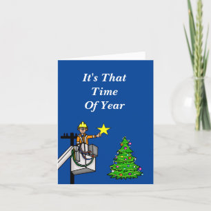 Leitungsmonteur im Korb bringt Stern auf den Baum  Karte