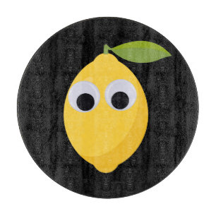Lemon, sweet fruit with googly eyes schneidebrett