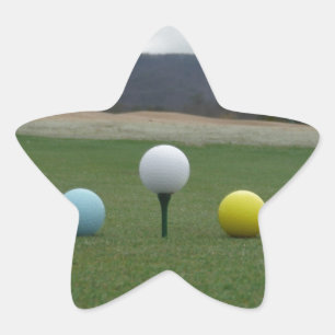 leuchtend farbige Golfbälle auf einem Berg Stern-Aufkleber
