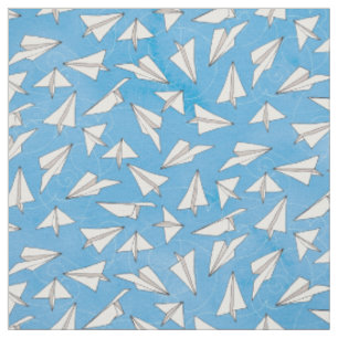 Leuchtendes Papierflugzeug auf blauem Muster Stoff