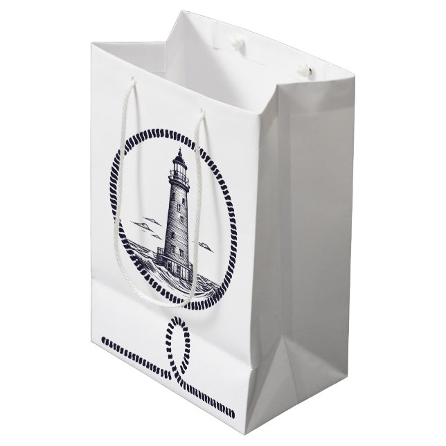 Leuchtturm am Meer in Rundseilrahmen Mittlere Geschenktüte (Vorderseite Schrägansicht)