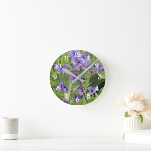 Libellen mit blauen Augen auf violetten Blumen Runde Wanduhr