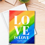 Liebe ist Liebe Gay Pride Rainbow Planer<br><div class="desc">Dieser Gay Pride-Planer ist mit LIEBE IS LIEBE in fett-weiße Typografie auf einem Aquarell-Regenbogen-Hintergrund von Rot, Orange, Gelb, Grün und Blau dekoriert. Einfach anpassbar mit Ihrem Namen und Jahr. Original Wasserfarbe © Michele Davies.</div>
