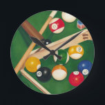 Lifelike Billiards Table with Balls and Chalk Runde Wanduhr<br><div class="desc">Rack 'em up with this spectacular painting of a billiards table by Jennifer Goldberger. The balls look new, the felt looks immaculate, and the chalk has already been applied to the cue sticks. Hang this in your home, or gift it to a friend or loved one who enjoys a game...</div>