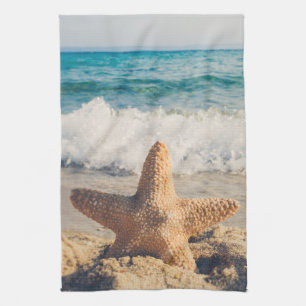 Linge De Cuisine Starfish sur une plage de sable Photo