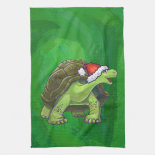Linge De Cuisine Tortue avec un chapeau de Père Noël sur fond vert