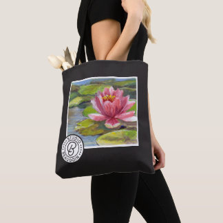 Lis de Rose-Pêche sur le sac fourre-tout vert