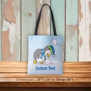 Little penguin getting a snow ball tote bag tasche