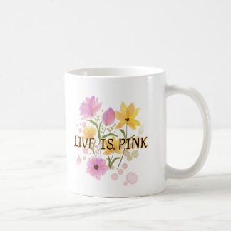 "LIVE IS PINK" is written in a dark Kaffeetasse