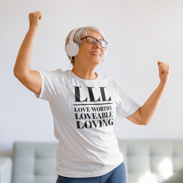 LLL - Liebe wert, liebenswert, liebenswert T-Shirt (Older woman dances in a "LLL: Love Worthy, Loveable, Loving" white t-shirt.)