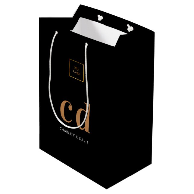 Logoeinträge in schwarzem Gold Mittlere Geschenktüte (Rückseite Schrägansicht)