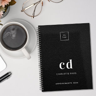 Logopartikel aus schwarzem Leder, Monogramm, Busin Planer