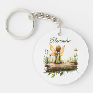 Lonely Fairy assis sur un journal