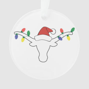 Longhorne blanche avec lumières de Noël et chapeau