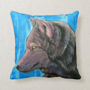 Loup noir d'imaginaire sur le coussin bleu