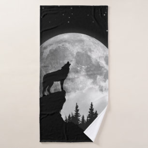 Loup noir et blanc hurlant sur la lune