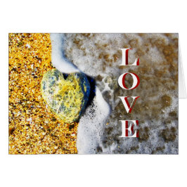 Love Pebble en forme de coeur sur la plage