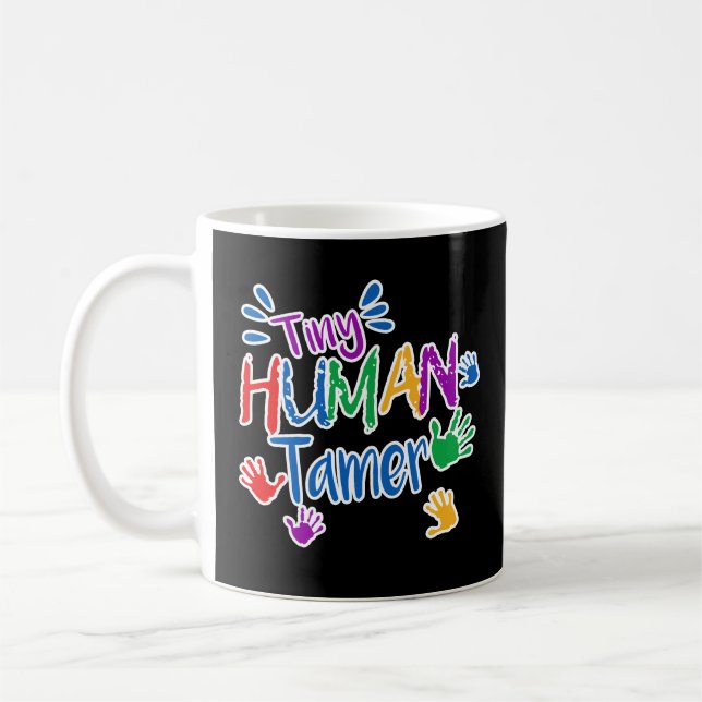Lustige kleine menschliche zahmere kaffeetasse (Links)