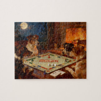 Lustige süße Hunde spielen ein Brettspiel