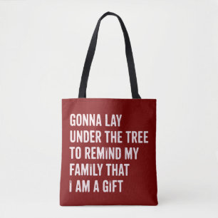 Lustige Weihnachtsgeschenke unter dem Baum Tasche
