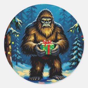 Lustiger Bigfoot, der ein Weihnachtsgeschenk hält Runder Aufkleber