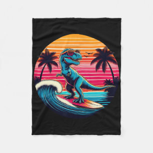Lustiger Dinosaurier surft Retro-Sonnenuntergang M Fleecedecke