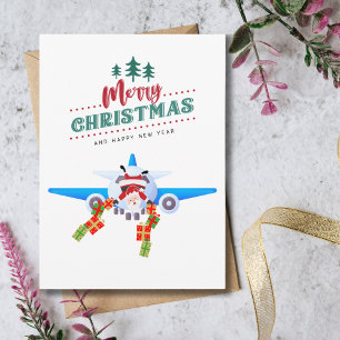 Lustiger Weihnachts-Santa im Flugzeug und Foto Karte
