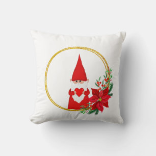 Lutin de Noël sur un coussin blanc jeté
