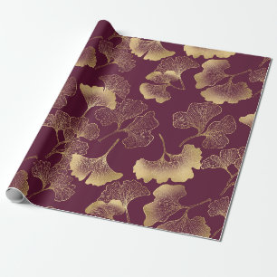 Luxuriöse goldene Ginkgoblätter auf tiefem Burgund Geschenkpapier