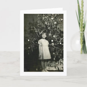 MÄDCHEN AN EINEM WEIHNACHTSBAUM KARTE