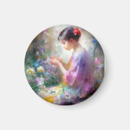 Mädchen bewundert eine Blume in ihren Händen Magnet