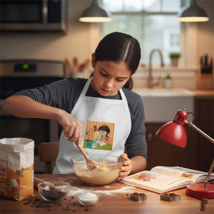 Mädchen, das am Schreibtisch Hausaufgaben macht Schürze