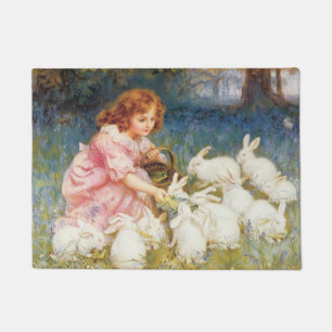 Mädchen, das die Kaninchen Füttre (von Frederick M Fußmatte